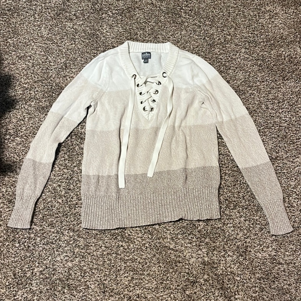 Striped sweater with shoe lace tie design
